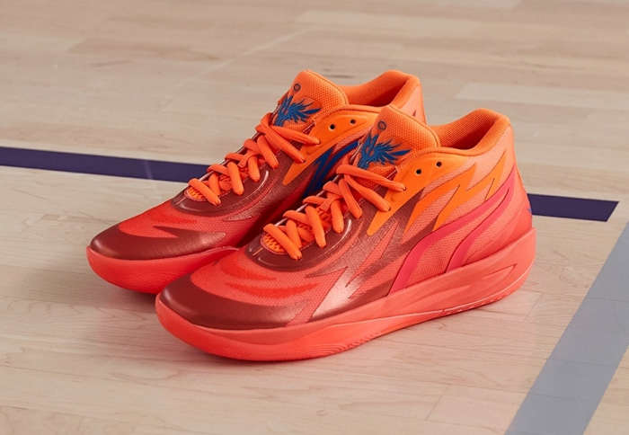 Red and orange Puma basketball shoes.